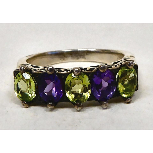 204 - A white metal dress ring, set with amethyst and peridot  stamped 925