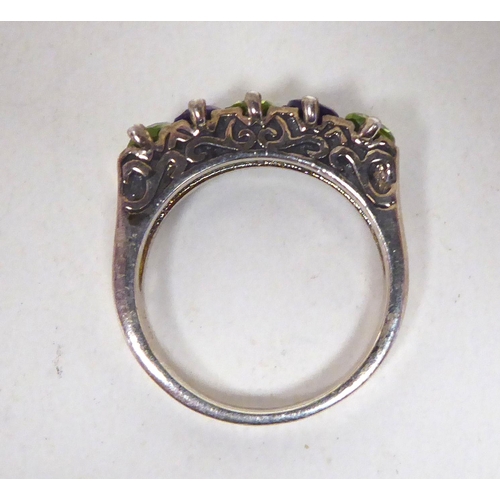 204 - A white metal dress ring, set with amethyst and peridot  stamped 925