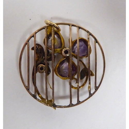 207 - Jewellery: to include a late Victorian yellow metal clover brooch, set with seed pearls and purple s... 