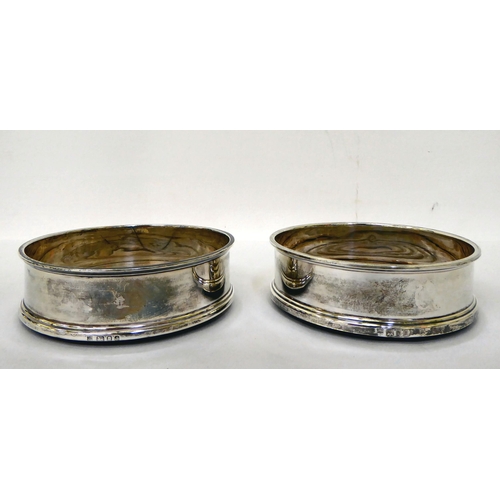 28 - A pair of silver wine coasters, each with a turned oak base  London 1973  5