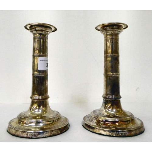 34 - A pair of loaded silver candlesticks, each on a circular base  Sheffield 1929  6.5