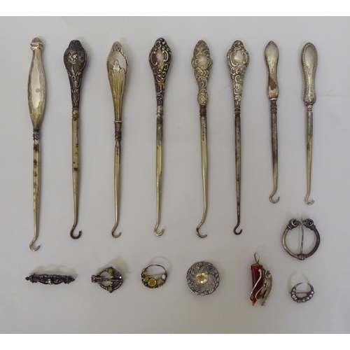 347 - Loaded silver handled and white metal items of personal ornament