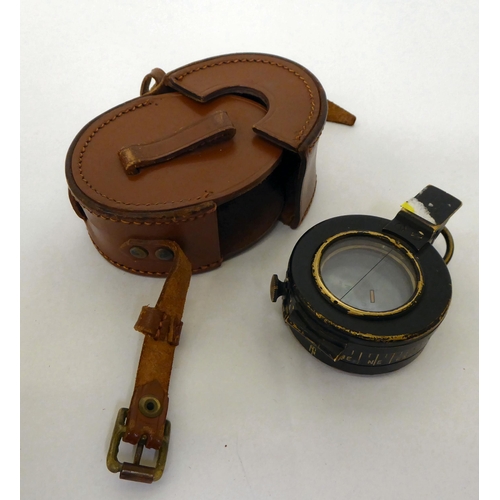 40 - A World War II Mark III compass No.818208, in a brown hide case(Please Note: this lot is subject to ... 