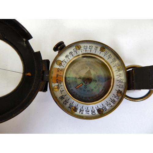 40 - A World War II Mark III compass No.818208, in a brown hide case(Please Note: this lot is subject to ... 