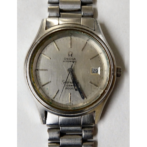 42 - An Omega automatic Seamaster Cosmic 2000 stainless steel cased and strapped wristwatch, faced by a b... 