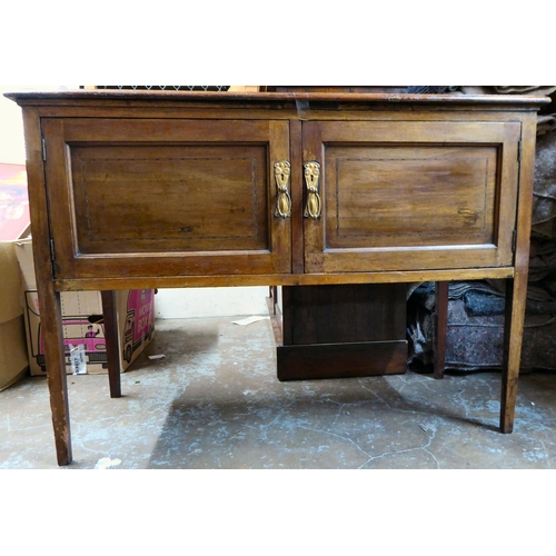 44 - An Edwardian stained beech and mahogany two door side cabinet, raised on square, tapered legs  ... 