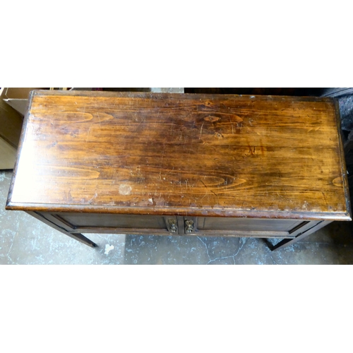 44 - An Edwardian stained beech and mahogany two door side cabinet, raised on square, tapered legs  ... 