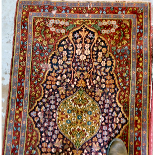 59 - Four dissimilar Persian and similar rugs, each individually decorated on multi-coloured grounds ... 