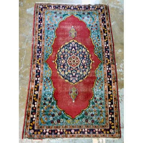 59 - Four dissimilar Persian and similar rugs, each individually decorated on multi-coloured grounds ... 