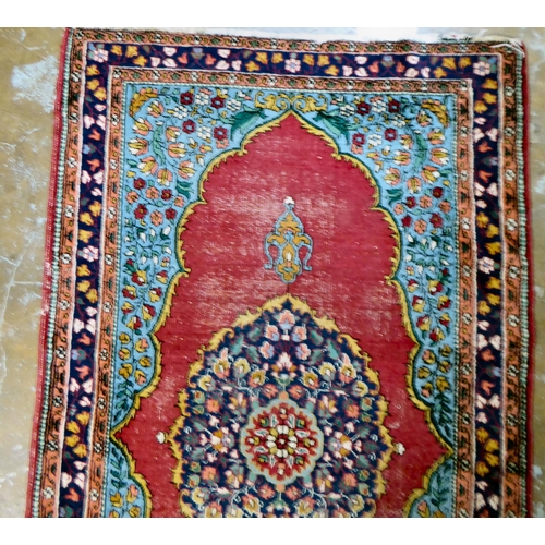 59 - Four dissimilar Persian and similar rugs, each individually decorated on multi-coloured grounds ... 