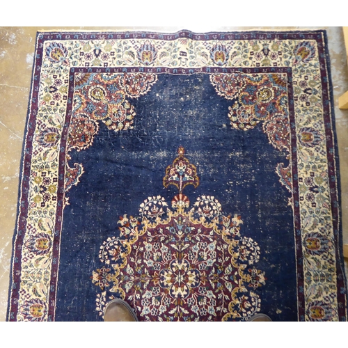 59 - Four dissimilar Persian and similar rugs, each individually decorated on multi-coloured grounds ... 