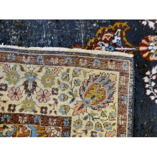 59 - Four dissimilar Persian and similar rugs, each individually decorated on multi-coloured grounds ... 