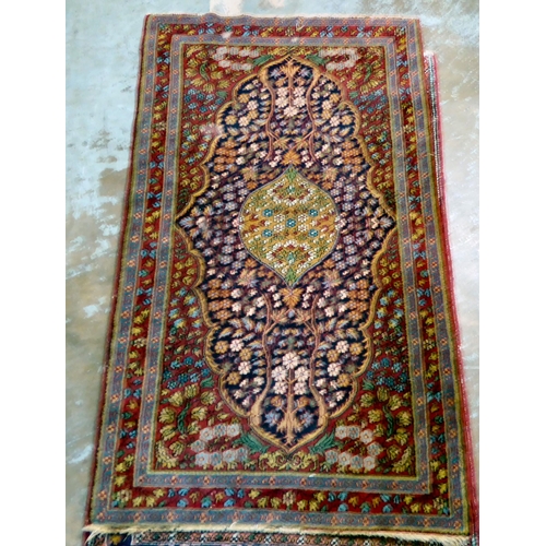 59 - Four dissimilar Persian and similar rugs, each individually decorated on multi-coloured grounds ... 