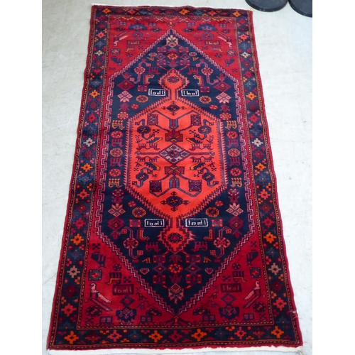 61 - A Shiraz rug, on a red ground  42