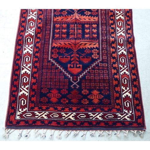 64 - A Turkish rug, on a red ground  44