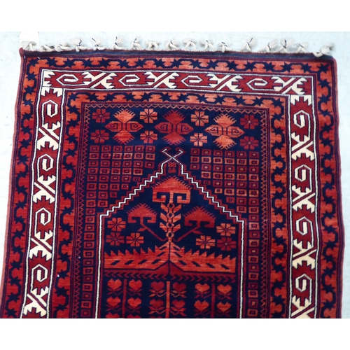 64 - A Turkish rug, on a red ground  44