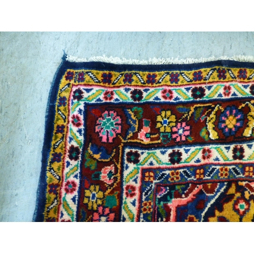 66 - A Hamadan design rug, decorated with floral motifs and a central medallion, on a navy blue ground&nb... 