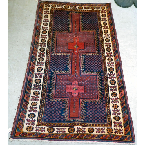 77 - An Afghan rug, on a multi-coloured ground  48