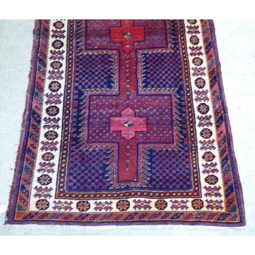 77 - An Afghan rug, on a multi-coloured ground  48