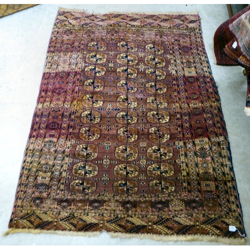 81 - A Turkoman rug, on a multi-coloured ground  56