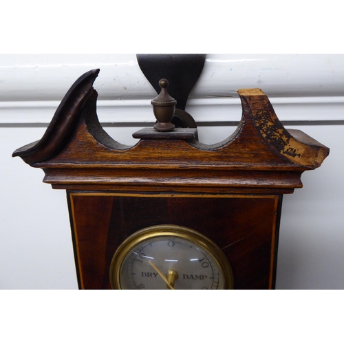 36 - An Edwardian string inlaid, mahogany cased wheel barometer  38