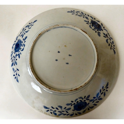 42 - A 20thC Japanese porcelain charger, decorated in colours and pictorial panels and on the obverse  be... 