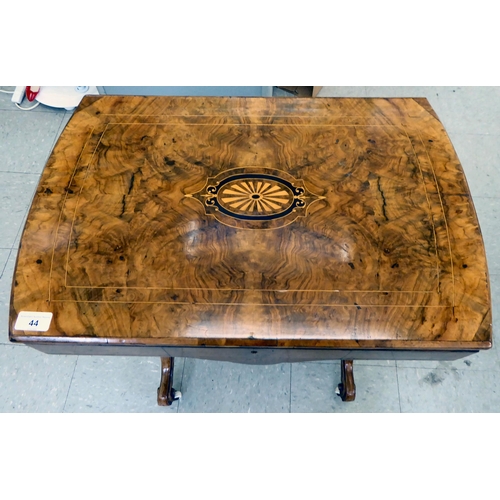 44 - An Edwardian marquetry and string inlaid, quarter walnut veneered and mahogany sewing table with a h... 