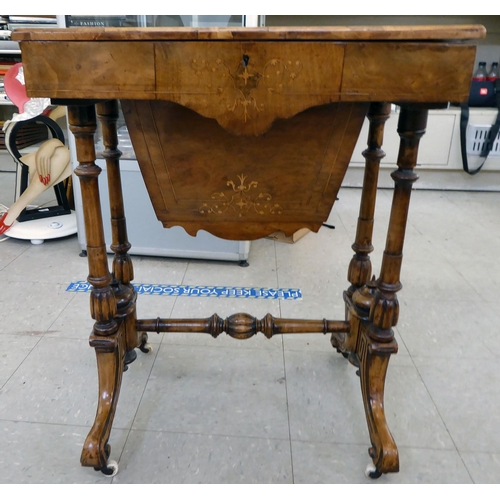 44 - An Edwardian marquetry and string inlaid, quarter walnut veneered and mahogany sewing table with a h... 