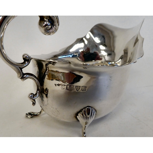 60 - Silver collectable items: to include a sauce boat with a cut, flared lip and C-scrolled handle, elev... 