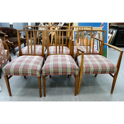 63 - A Gordon Russel teak dining table, raised on turned legs  30