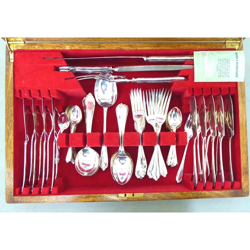 64 - James Deakin & Co silver plated canteen of cutlery and flatware, in a mahogany case