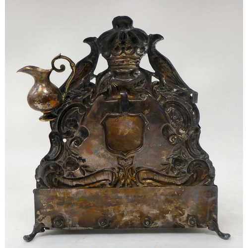 11 - A late 19thC (probably Polish), silver plated Hanukah lamp, the backplate embossed with two birds of... 