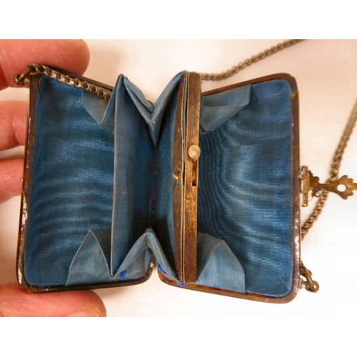 24 - A late Victorian tortoiseshell purse of cushion form with white metal corners and clasps, inlaid in ... 