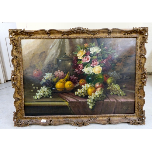 244 - A still life study of flowers and fruit  oil on canvas  bears an indistinct signature ... 