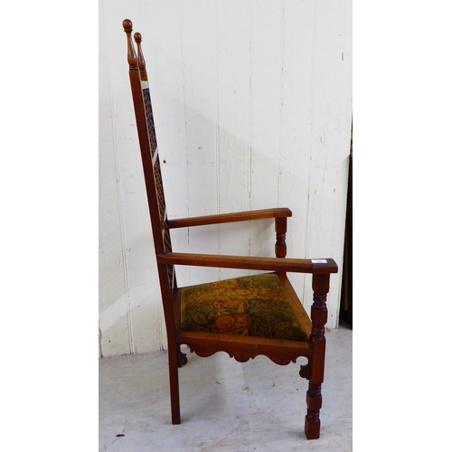 245 - A late Victorian oak framed Anglo-Moorish Liberty Cairene chair, illustrated in Liberty Furniture 18... 