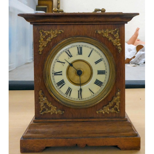 247 - A mixed lot: to include a late 19thC mahogany cased mantel clock; the movement faced by a Roman dial... 