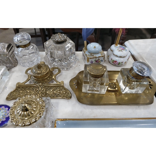 254 - Variously constructed inkwells: to include glass; china; and brass examples  largest 4