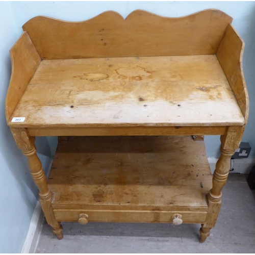 263 - An early 20thC rustic pine, two tier washstand, raised on turned and block legs  34