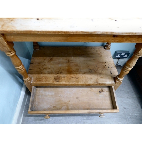 263 - An early 20thC rustic pine, two tier washstand, raised on turned and block legs  34