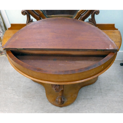 265 - A late Victorian Duchess style mahogany dressing table, surmounted by an oval mirror, over a hinged ... 