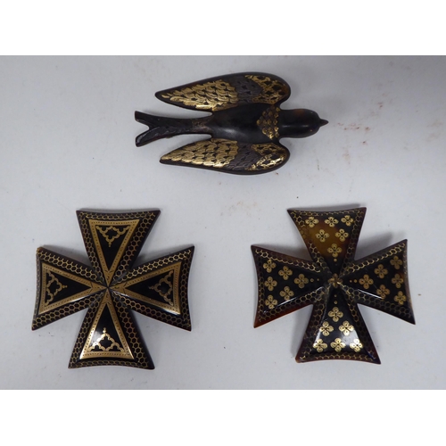 37 - Five dissimilar 19thC piquetworked tortoiseshell brooches, finely inlaid with yellow metal: to inclu... 