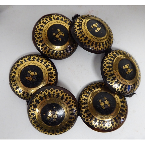 38 - 19thC piquetworked tortoiseshell items of personal ornament, finely inlaid with yellow metal: to inc... 