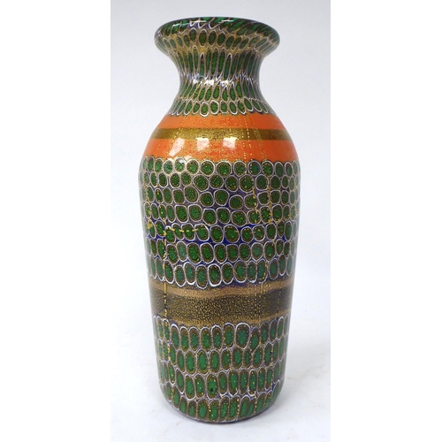 5 - A Murano glass vase, randomly decorated in gilding and coloured designs of baluster form with a flar... 