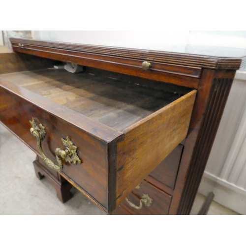 60 - A Georgian Chippendale influenced mahogany desk with canted, reed carved corners, the top incorporat... 