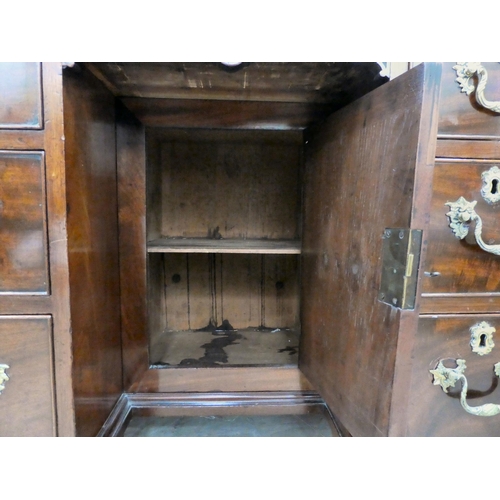 60 - A Georgian Chippendale influenced mahogany desk with canted, reed carved corners, the top incorporat... 