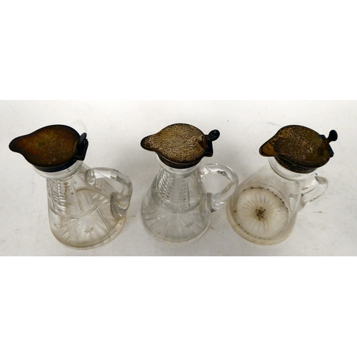 7 - A pair of Edwardian cut glass whisky tots with applied silver collars and caps  H&H  Birmingham ... 