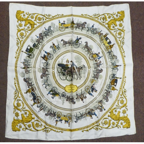 94 - A Hermes cream and gold coloured silk scarf  'La Promenade de Longchamps, Ledoux'  34