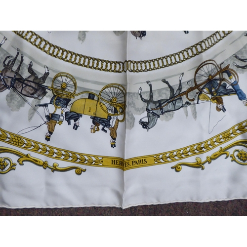 94 - A Hermes cream and gold coloured silk scarf  'La Promenade de Longchamps, Ledoux'  34