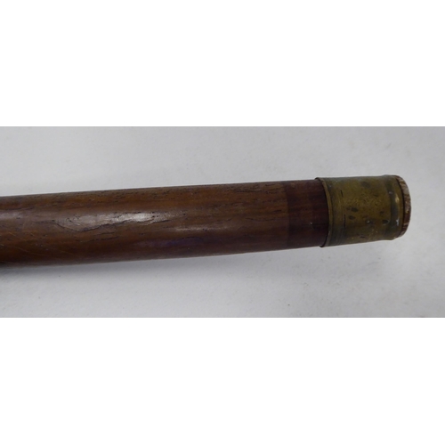 95 - An Aboriginal hardwood walking stick, the terminal fashioned as a finely carved man's head  40