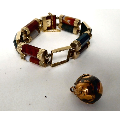 96 - A Scottish coloured hardstone and gold coloured metal tablet and cylinder link bracelet, on a bayone... 